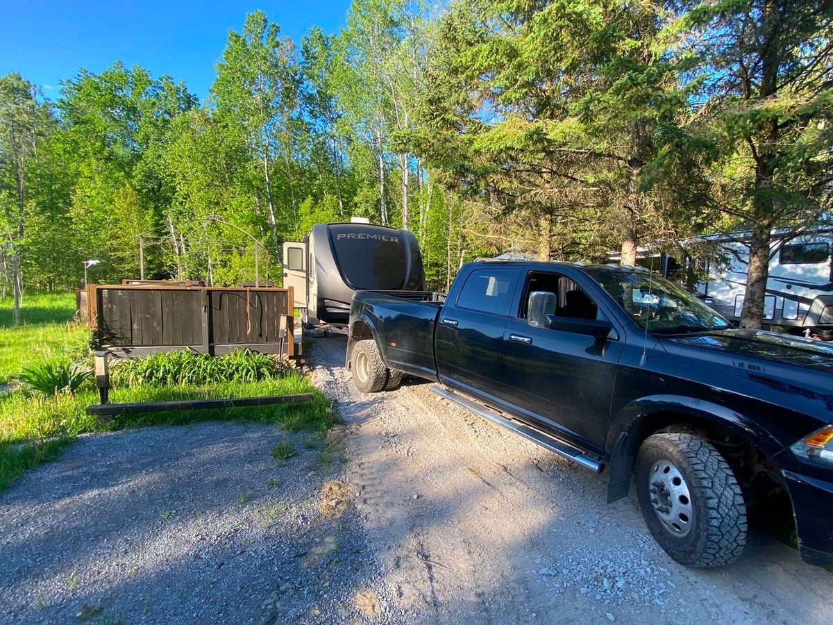 Kawartha RV crew maneuvering a trailer into a site